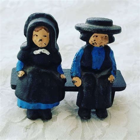 Mother, Father and Child. . Cast iron amish figurines